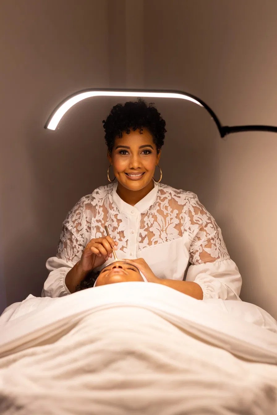 Tamara Jones, Founder of The Melanated Skin Registry, at the treatment table